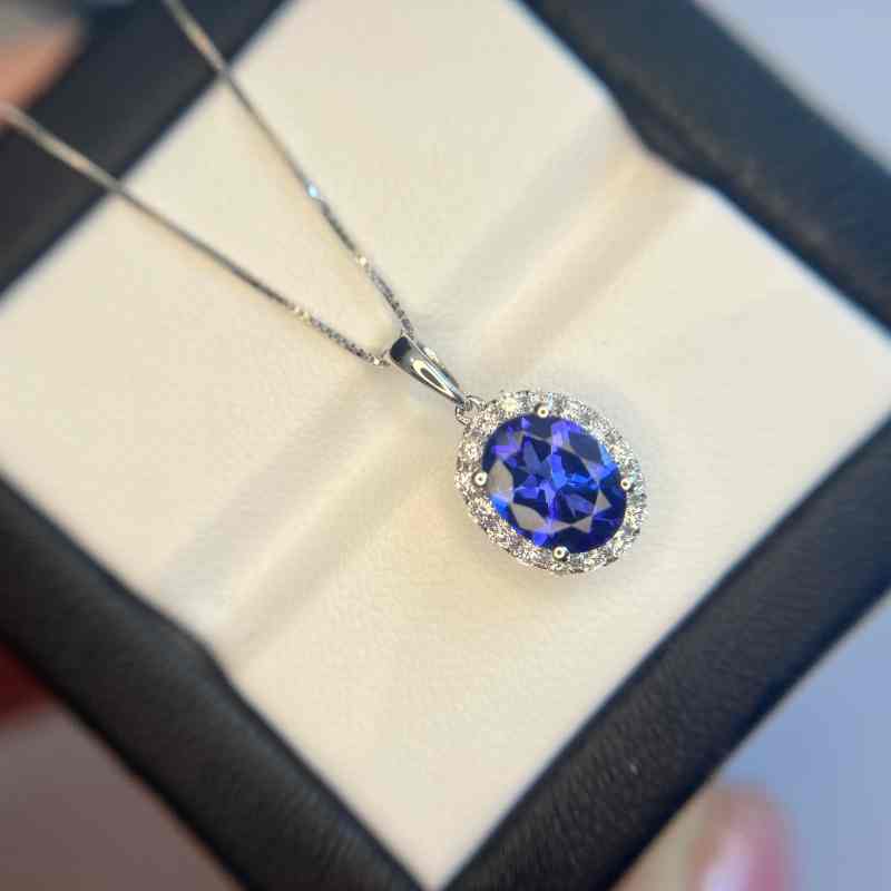 “Kate” Classic 2.00 Carat Oval Tanzanite & Diamond Halo Pendant.