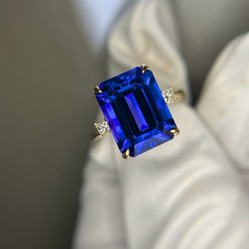Emerald Cut Tanzanite Ring with Princess Cut Diamonds