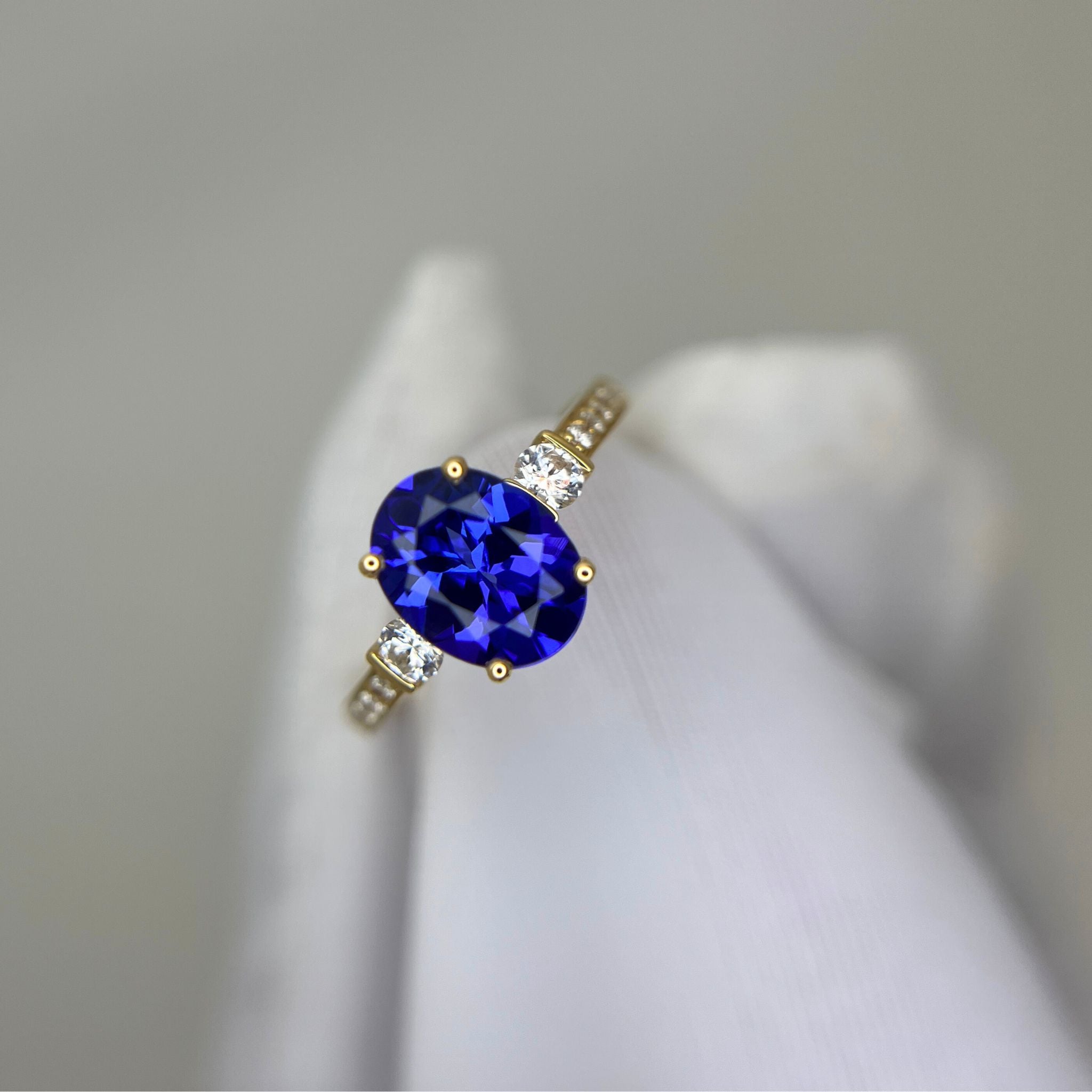 “Evening Sky” Oval Tanzanite & Diamond Ring - Yellow Gold