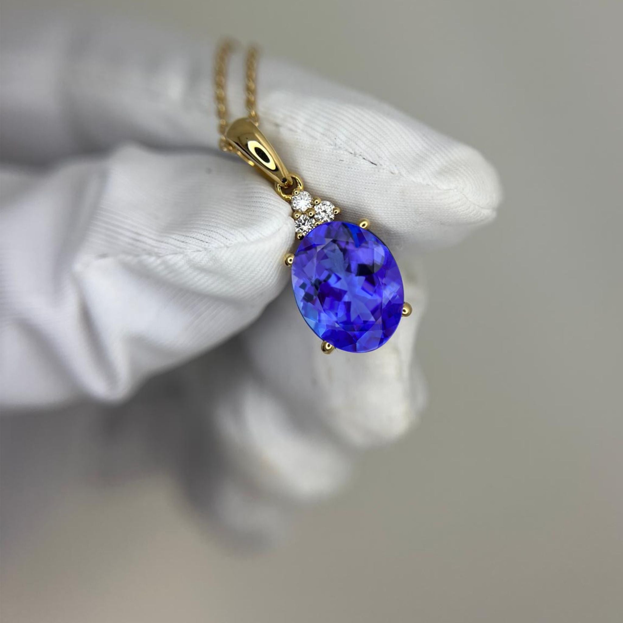 Oval Tanzanite & Diamond Pendant -  Yellow Gold