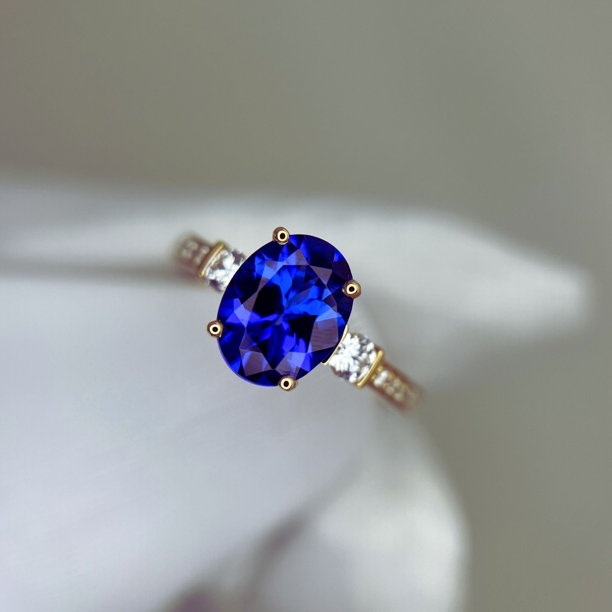“Evening Sky” Oval Tanzanite & Diamond Ring - Yellow Gold