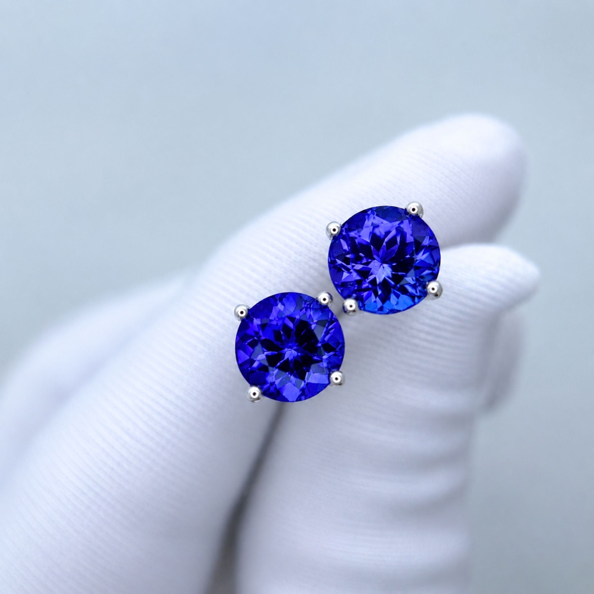 AAA grade round tanzanite earrings displaying vivid colour saturation
