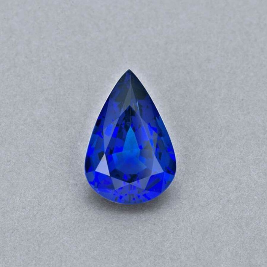 Emerald-cut tanzanite gemstone with vivid royal blue colour
