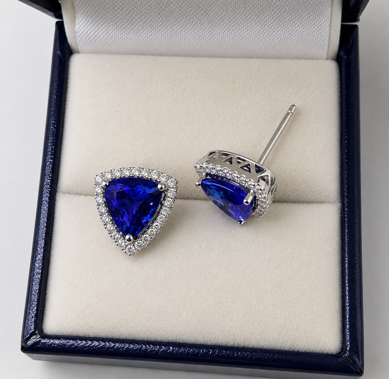 AAA grade trillion cut tanzanite earrings with diamond halo accents