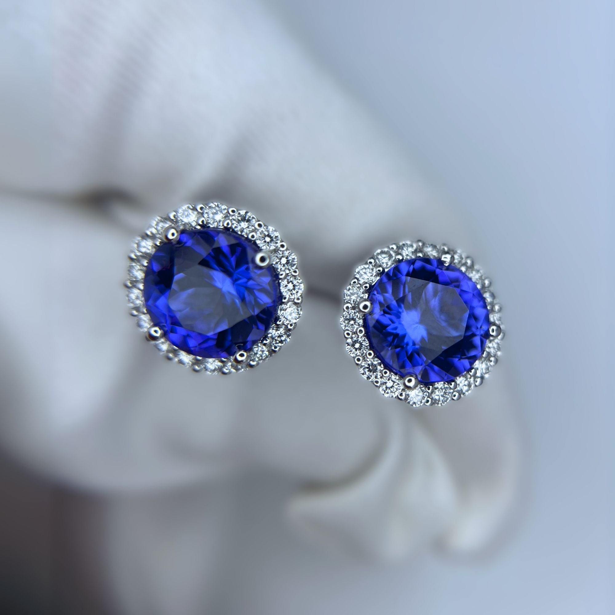 Exceptional Tanzanite (+5 Carat) and Diamond Halo Stud Earrings – 18ct White Gold