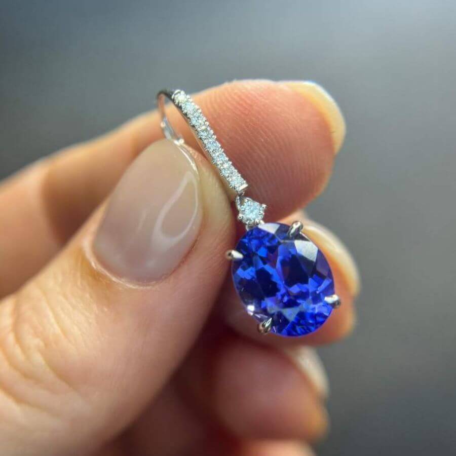 natural light aaa grade Natural tanzanite earrings with oval cut gemstones, 7.00 carats total, white gold setting.