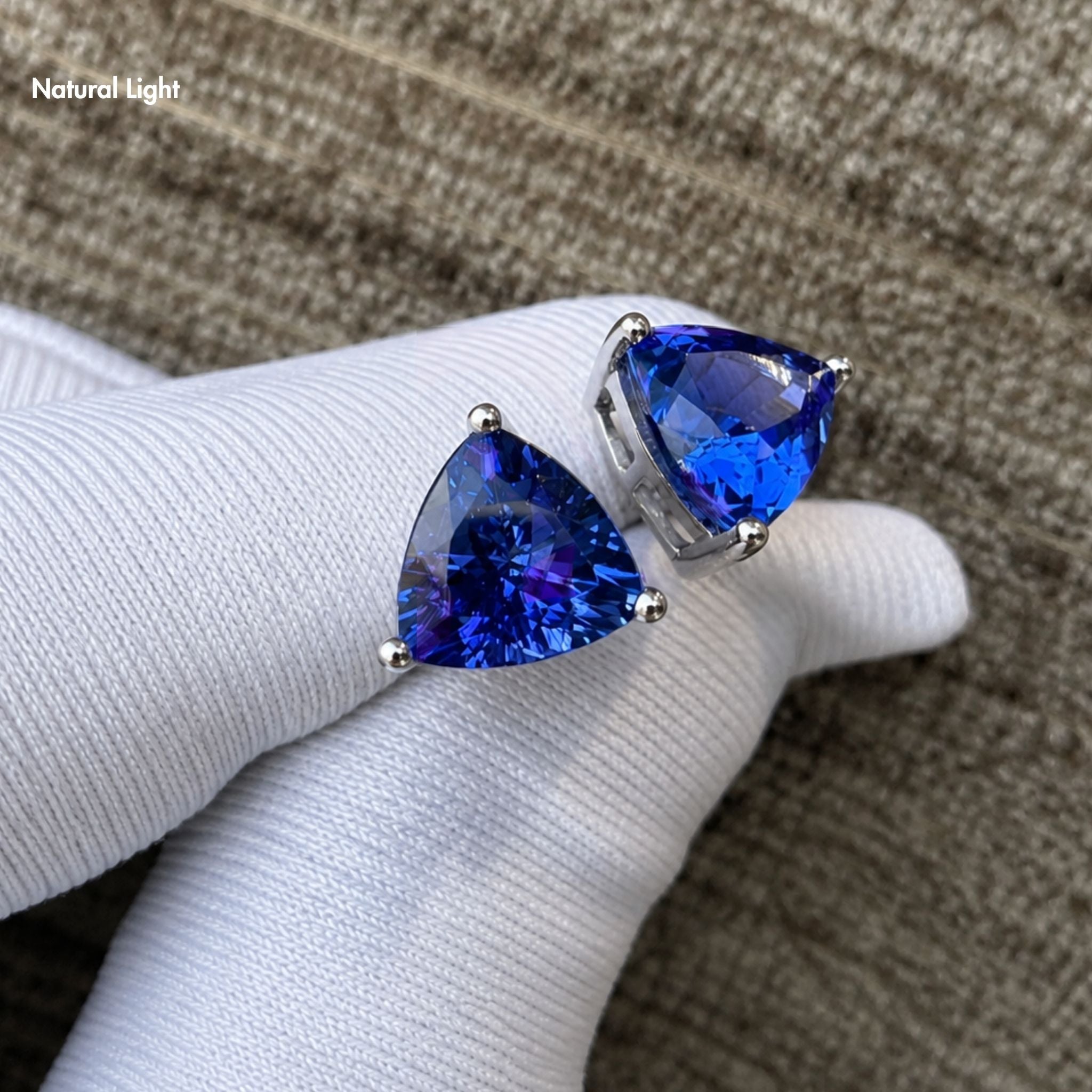 Luxury trillion cut tanzanite earrings in white gold with exceptional brilliance