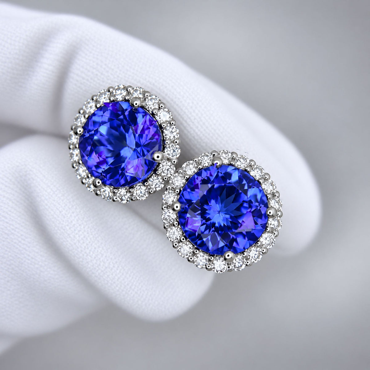 Exceptional Tanzanite (+6 Carat) and Diamond Halo Stud Earrings – 18ct White Gold