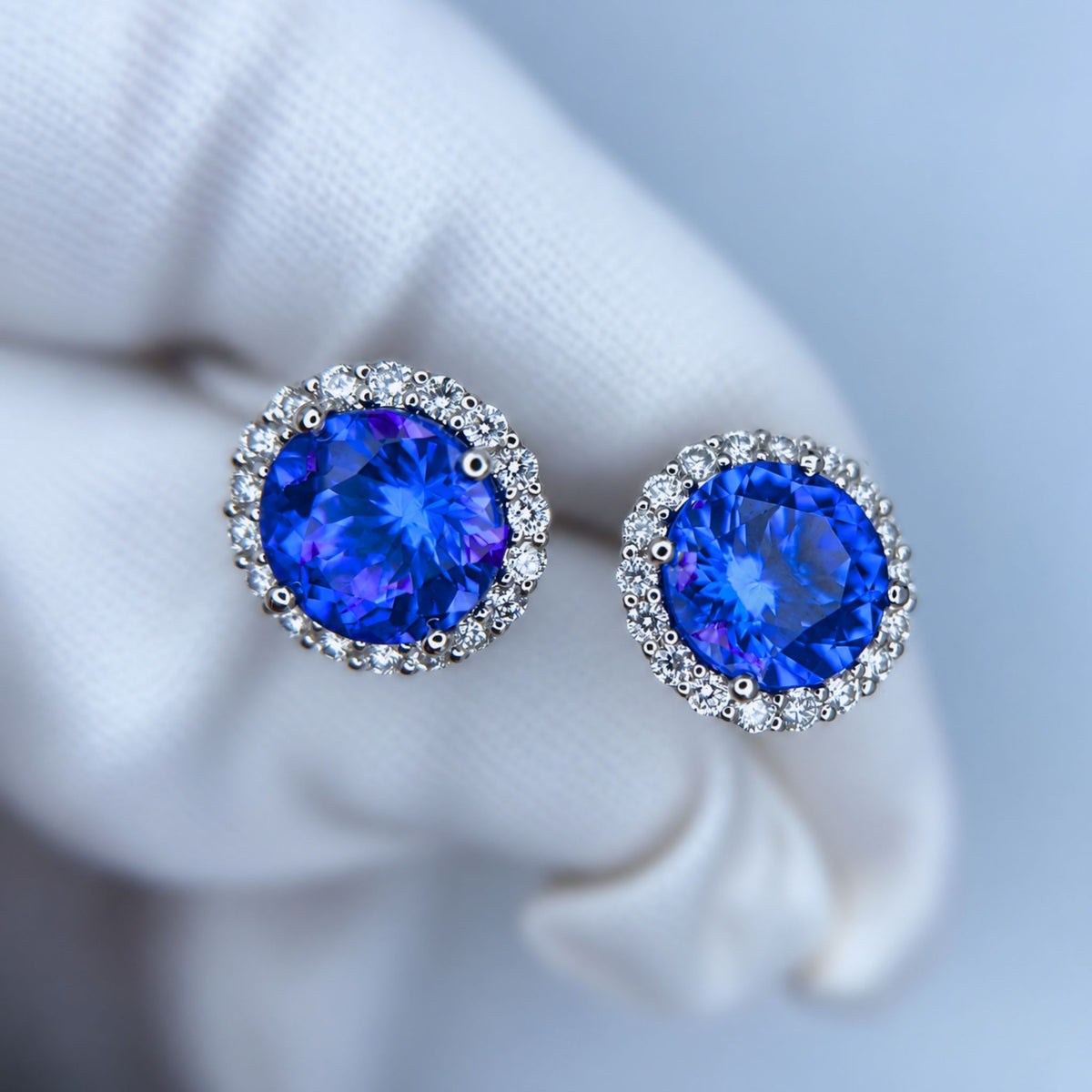 Exceptional Tanzanite (+6 Carat) and Diamond Halo Stud Earrings – 18ct White Gold