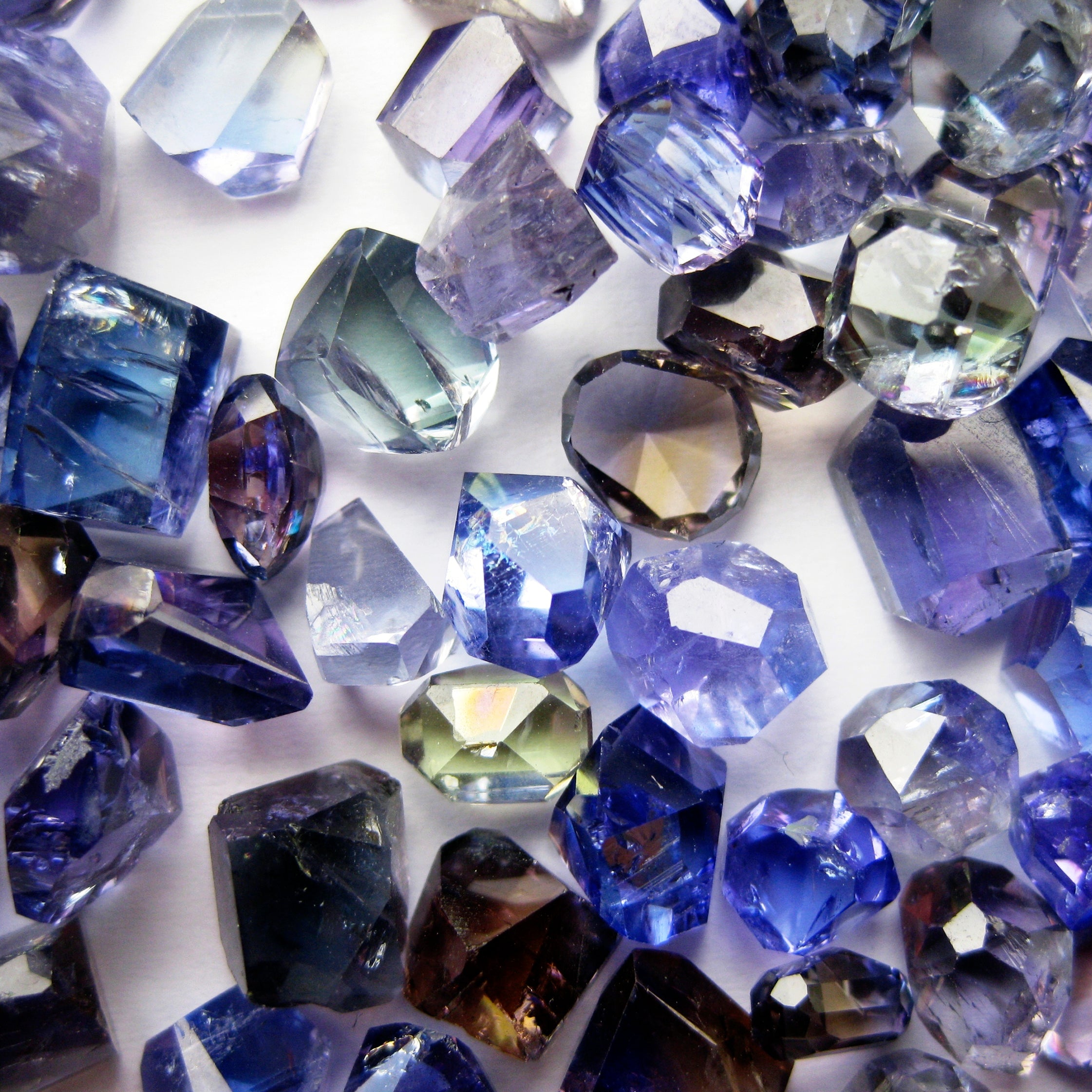 unheated tanzanite crystals showing blue, brown and green colors 