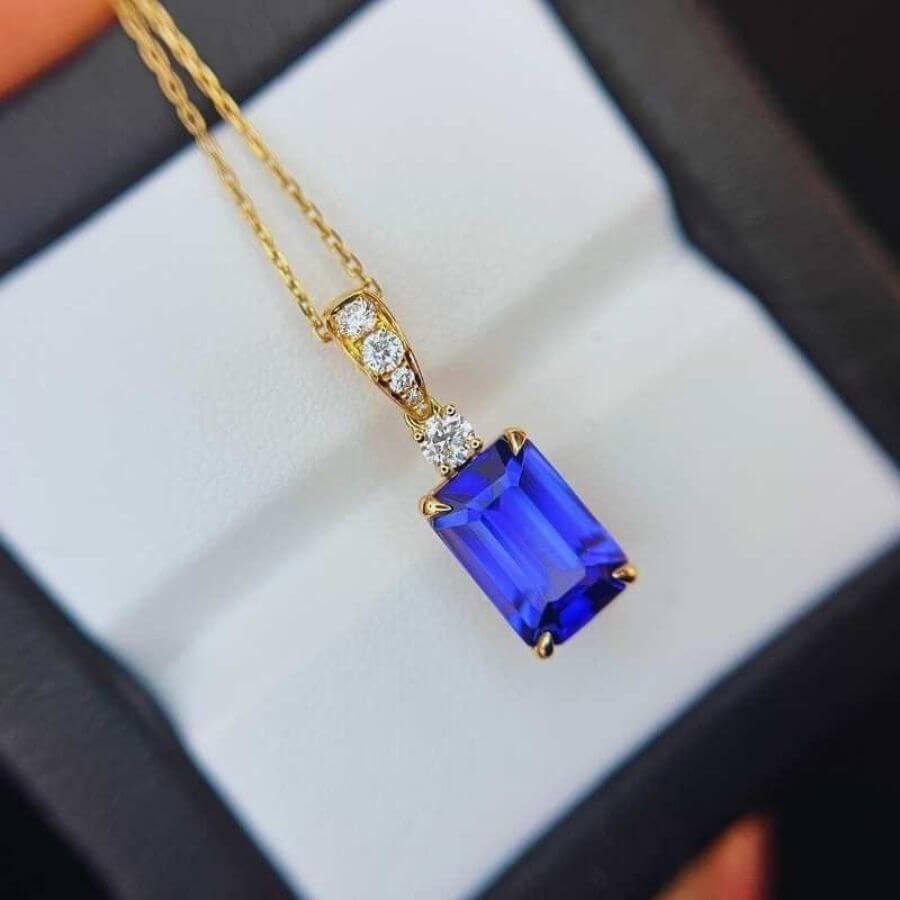 Made to Order: Exceptional Emerald Cut Tanzanite & Diamond Pendant