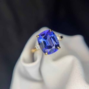 Beautiful antique cushion cut tanzanite engagement ring in yellow gold.